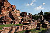 Ayutthaya, Thailand. Wat Mahathat, a Buddha statue of the gallery enclosing the collapsed central prang. 